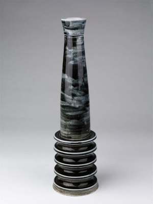 William Gordon ceramic lamp base from 1950: a tall blue-black streaked column on a stack of ribbed discs